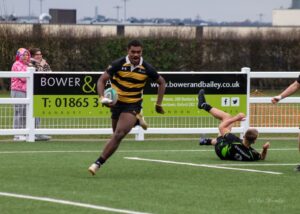 student playing rugby