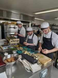 Students preparing dishes