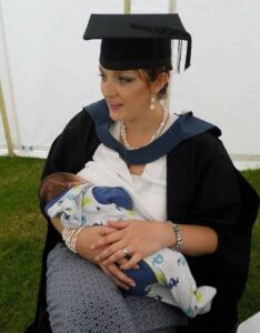 Hannah O'Neill breastfeeding at her graduation
